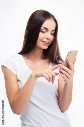 Smiling pretty woman using smartphone