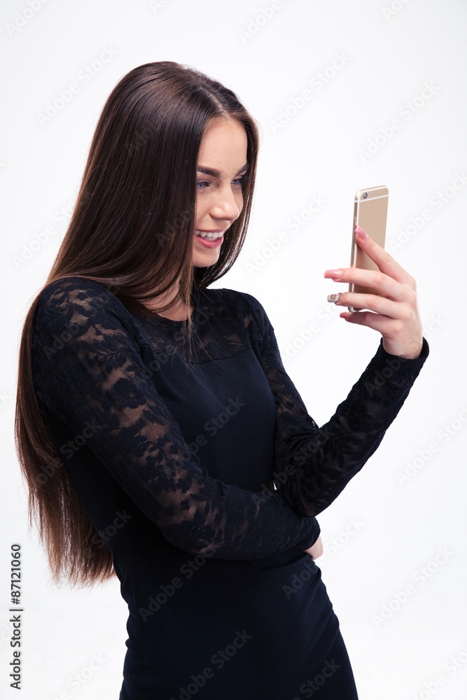 Woman in black dress using smartphone Woman in black dress using smartphone