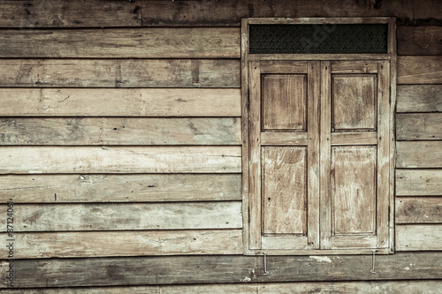 Wooden window on wooden wall