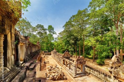 View of galleries and ruins of ancient Ta Keo temple in Angkor photo