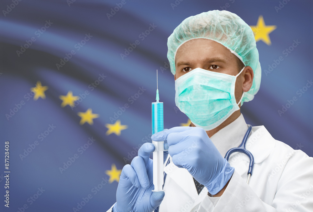 Doctor with syringe in hands and US states flags on background series - Alaska Doctor with syringe in hands and US states flags on background series - Alaska