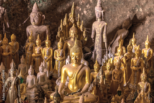 The old Buddha statue in cave at Laos