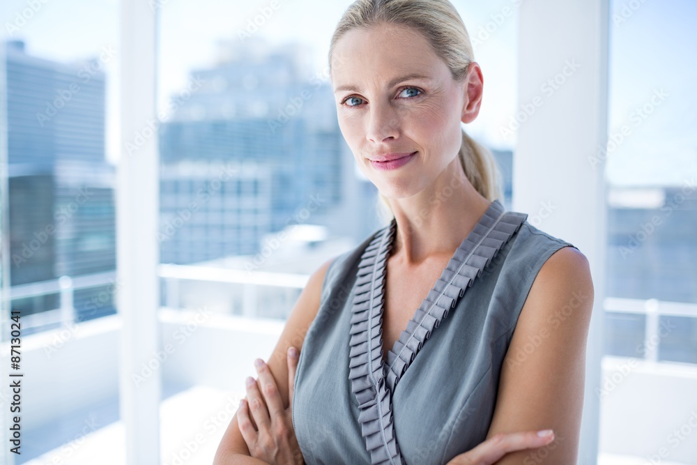 Thoughtful businesswoman standing in the office Thoughtful businesswoman standing in the office