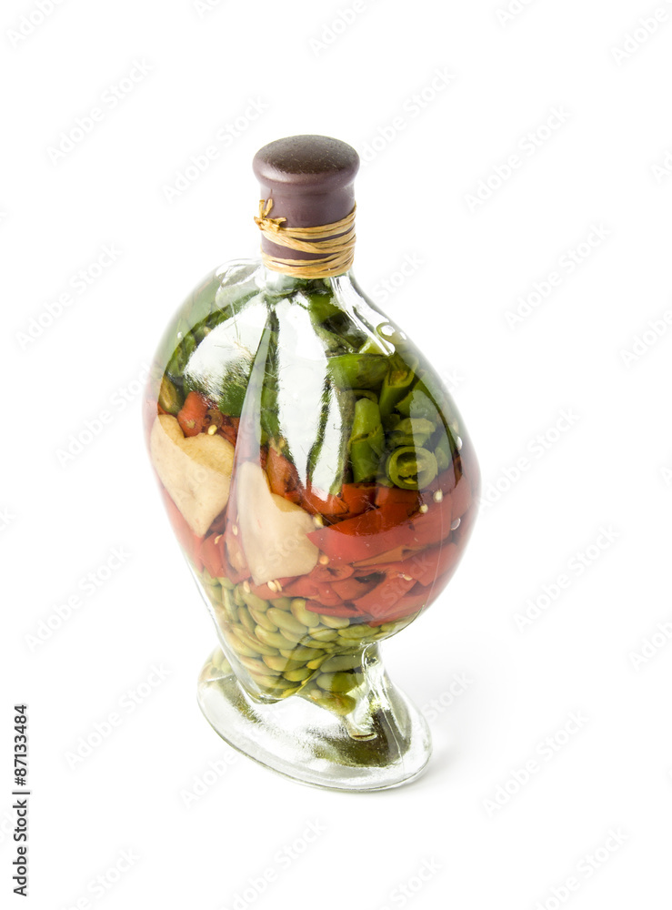 Decorative salted seeds in a glass bottle isolated on white Decorative salted seeds in a glass bottle isolated on white