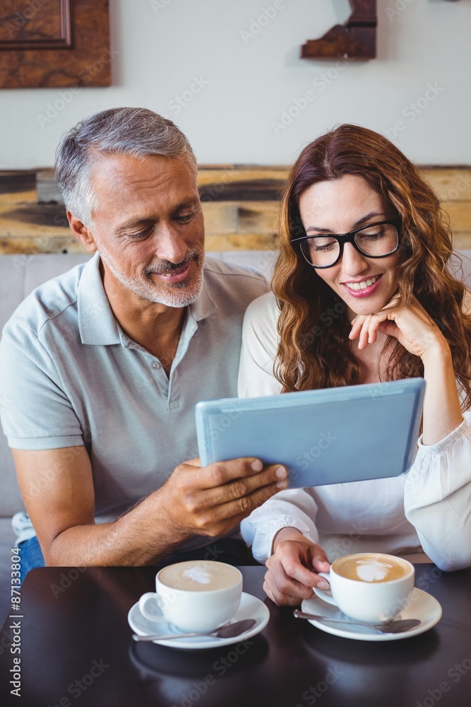 Couple using digital tablet Couple using digital tablet
