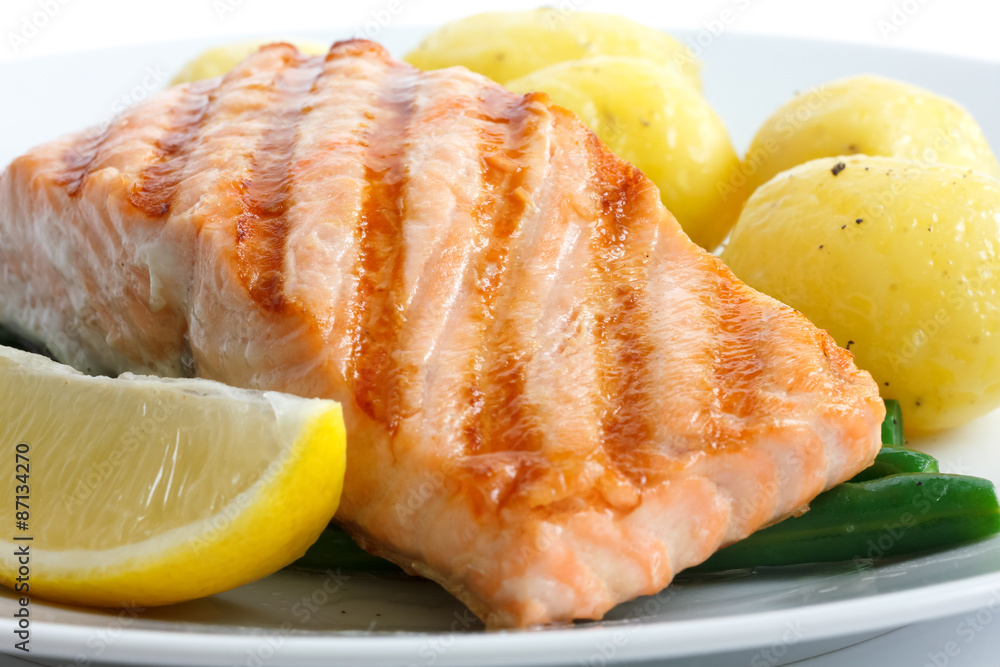 Juicy grilled salmon fillet with string beans and boiled potatoe Juicy grilled salmon fillet with string beans and boiled potatoe