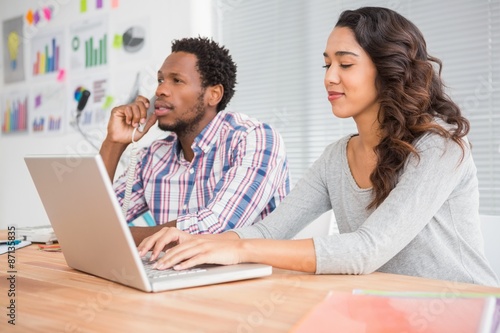 Young business people on the laptop