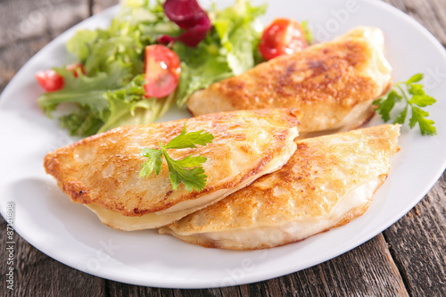 salad and crepe with cheese and ham