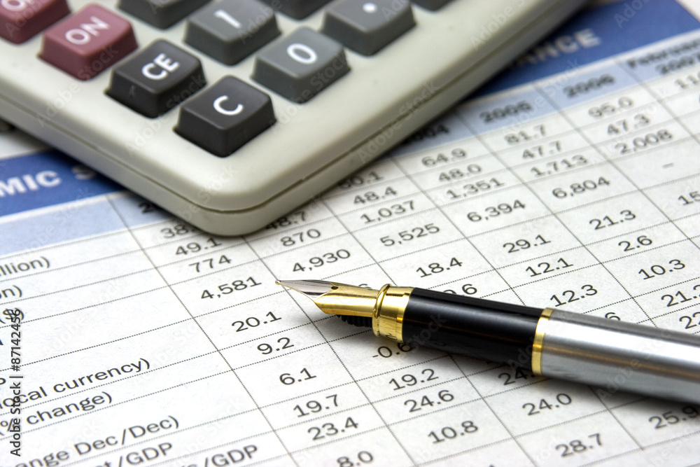 fountain pen and calculator close up fountain pen and calculator close up