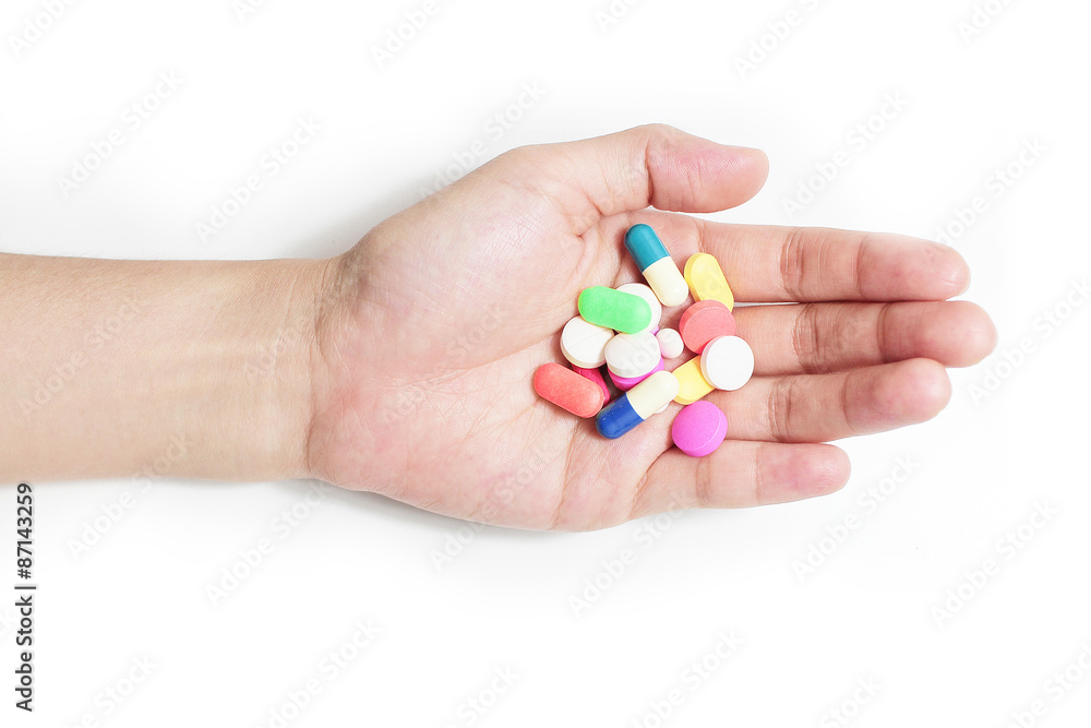 hand hold many medicine, boxes of medicines in the background