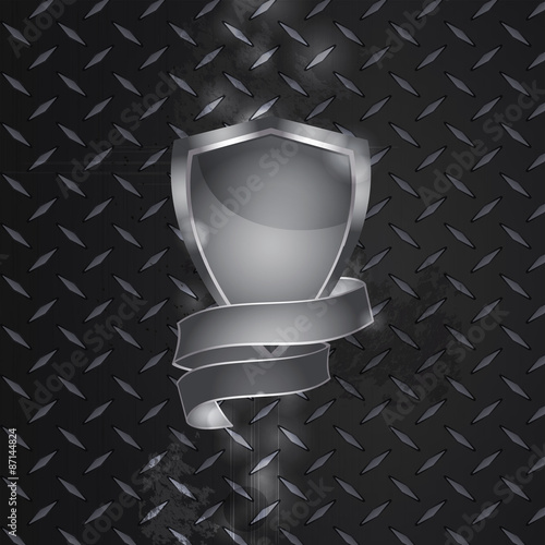 Metal shield and banner on metallic plate
