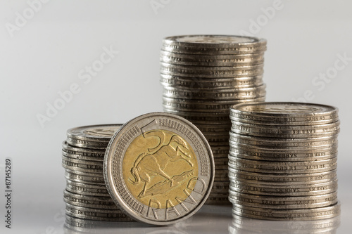 Fotografie silver coins piled and side view of money