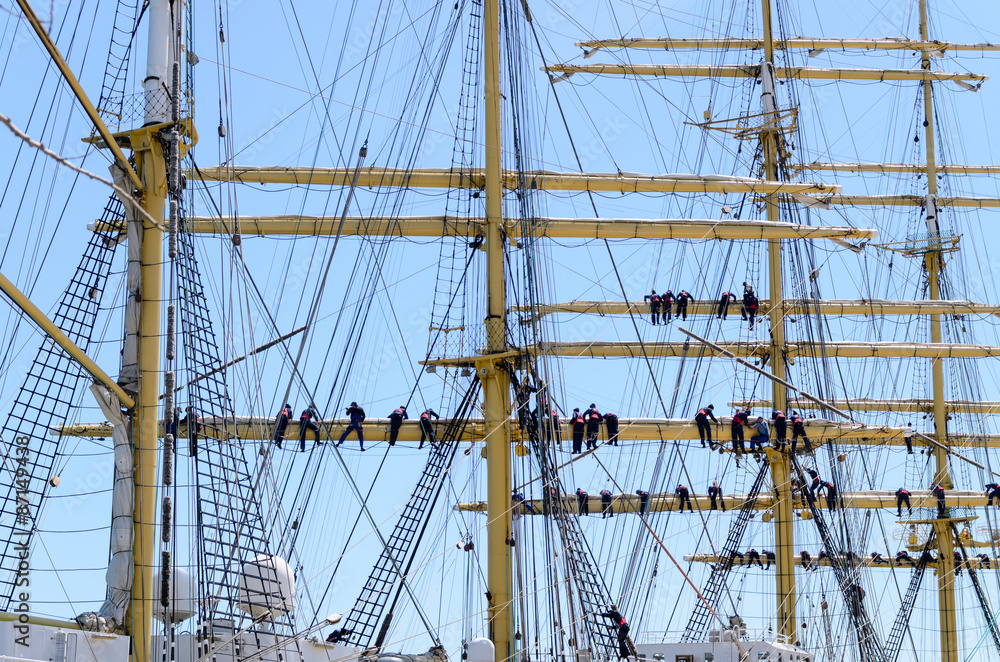 Sailors on the rigging of a tall ship Sailors on the rigging of a tall ship