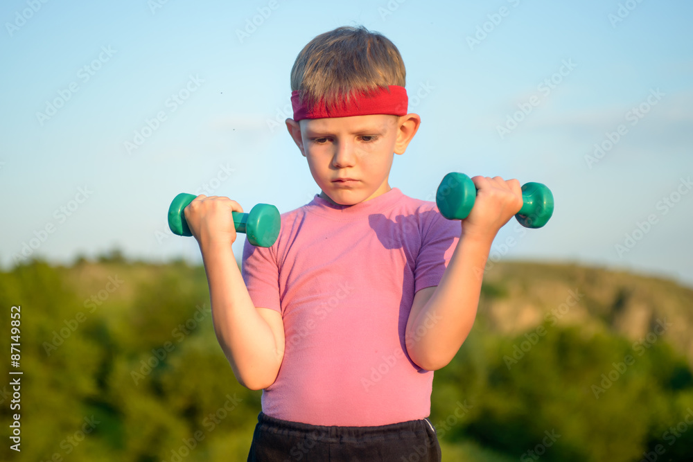 Athletic Cute Boy Lifting Two Small Dumbbells Athletic Cute Boy Lifting Two Small Dumbbells