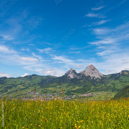 Impressive clouds over the mountains. Dramatic Sky. The little town Schwyz. On the horizon a mountain peak Great Mythen , Mythenregion.