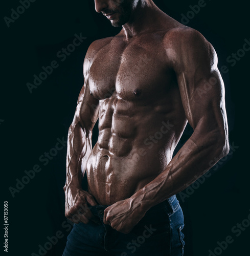 muscle man torso on black background, bodybuilding athlete portr