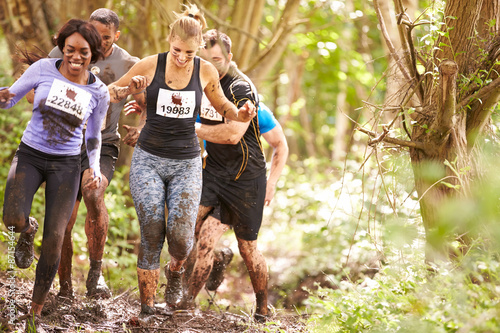 Картината върху платно Competitors running in a forest at an endurance event
