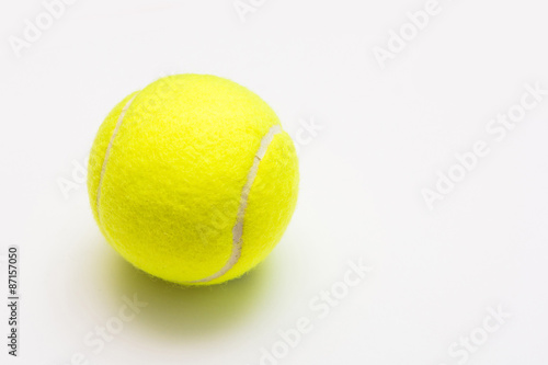 green tennis ball on white background © Sunanta
