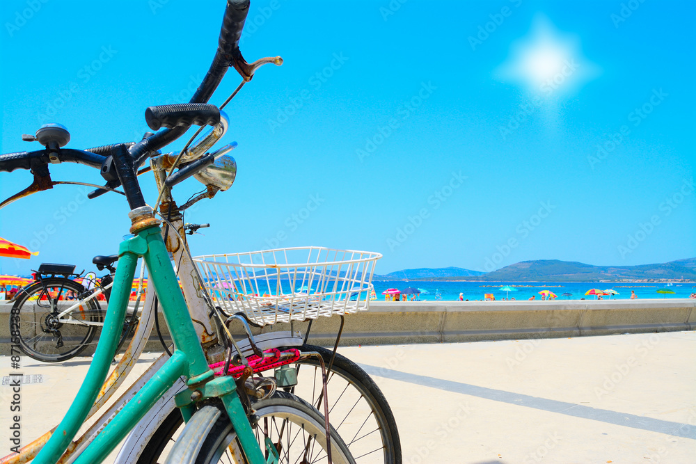 Fototapeta premium vintage bikes by hte sea in Alghero