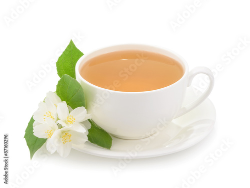 Cup of green tea with jasmine flowers isolated on white backgrou