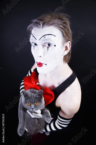 mime with red bow and  gray  British cat photo