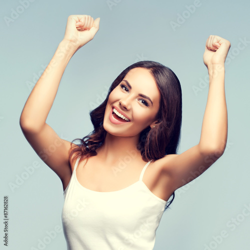 Happy gesturing young woman