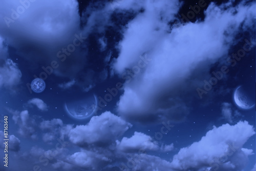 Planets, moon and stars in cloudy sky