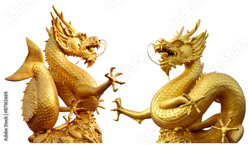 Double golden dragon statue at isolated on white background