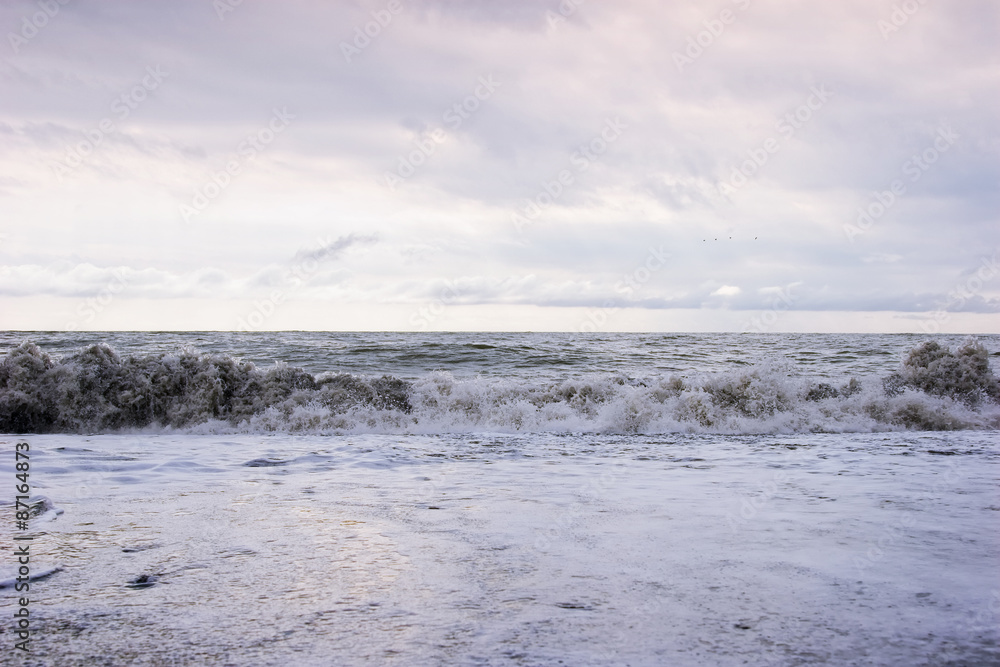 Ocean waves on a sandy beach Ocean waves on a sandy beach