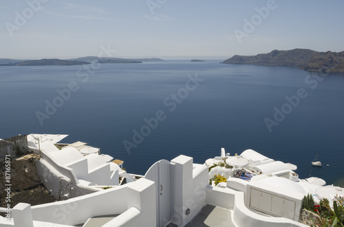 Traditional view of houses above the sea in Oia, Santorini, Greece.