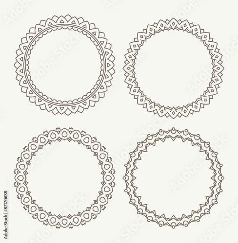 Set of 4 rich decorated calligraphic round frames.