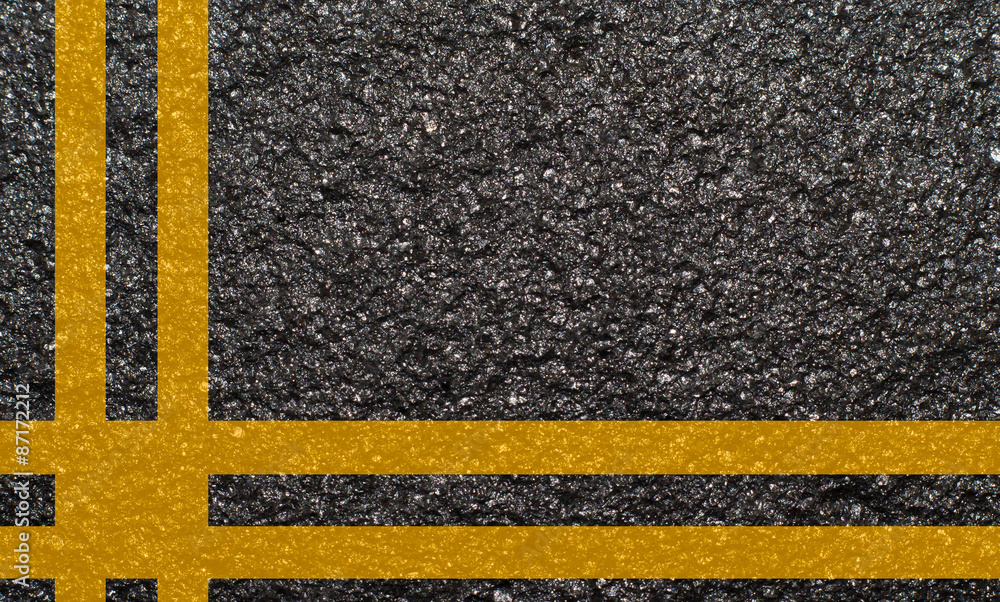 Double yellow line on asphalt texture