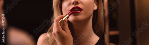 Woman is doing make-up photo