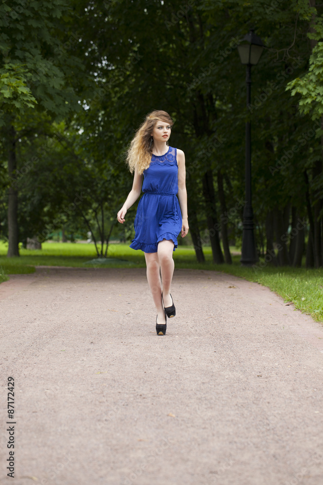 Beautiful young blonde woman in blue dress Beautiful young blonde woman in blue dress
