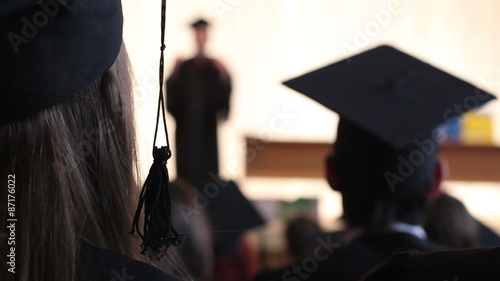 College professor, headmaster reading lecture to students, delivering speech