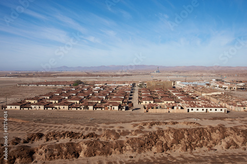 Derelict and rusting accommodation village at the historic Humberstone Saltpeter Works in the Atacama Desert near Iquique in Chile. The site is now an open air museum and a Unesco World Heritage SIte. photo