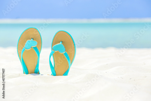 Flip Flops with hearts on a sandy beach
