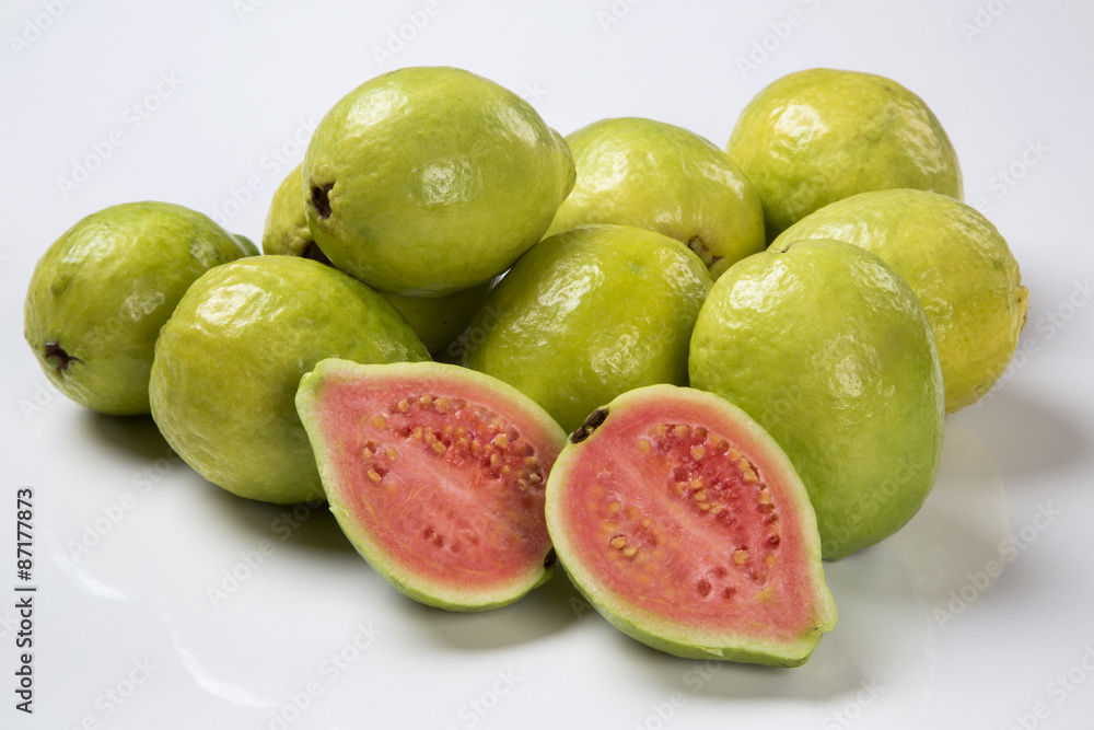 Some brazilian guavas over a striped surface. Some brazilian guavas over a striped surface.