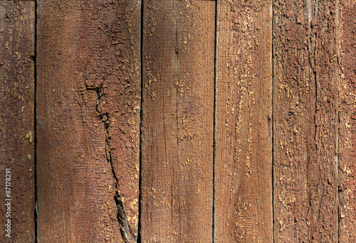 Old wooden planks with remnants of paint. Backgrounds and textur