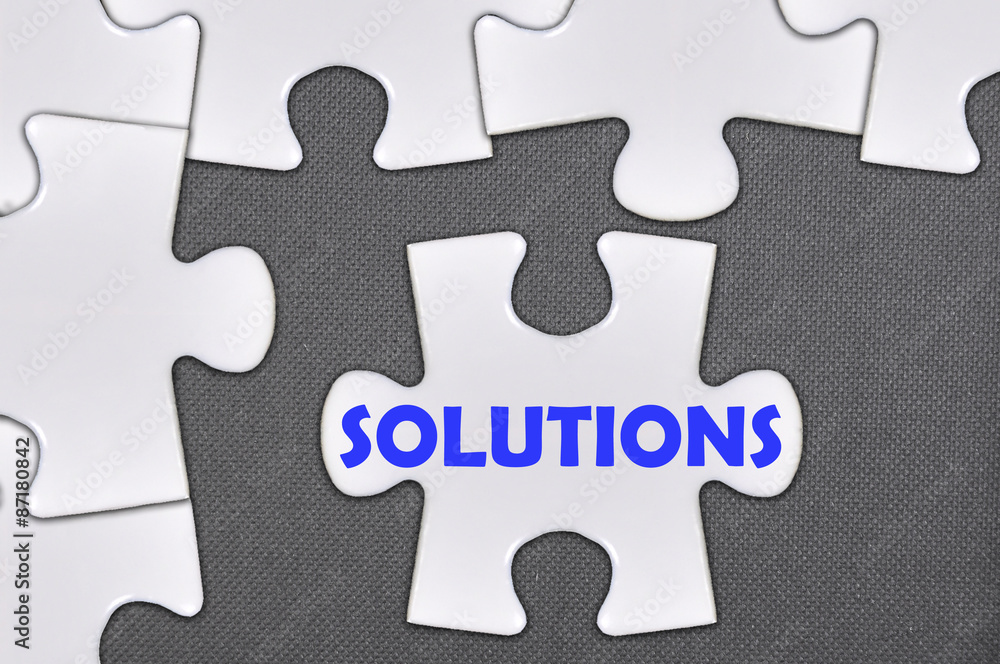 Fototapeta premium jigsaw puzzle written word solutions