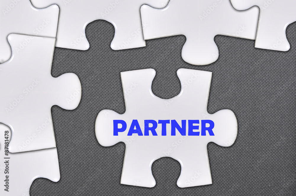 Fototapeta premium jigsaw puzzle written word partner