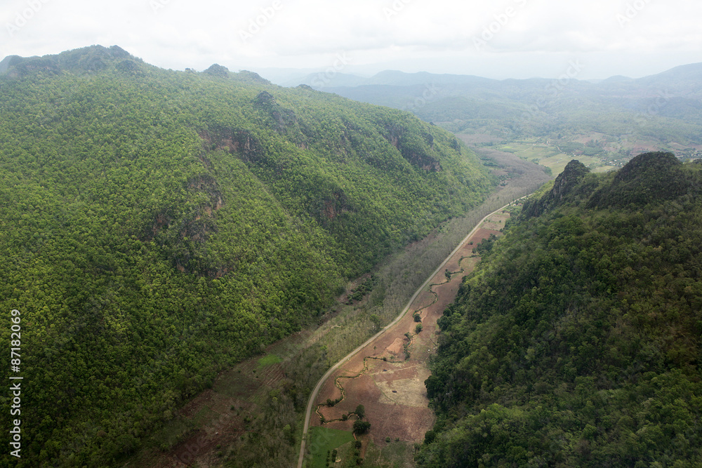 Road and river between mountain Road and river between mountain