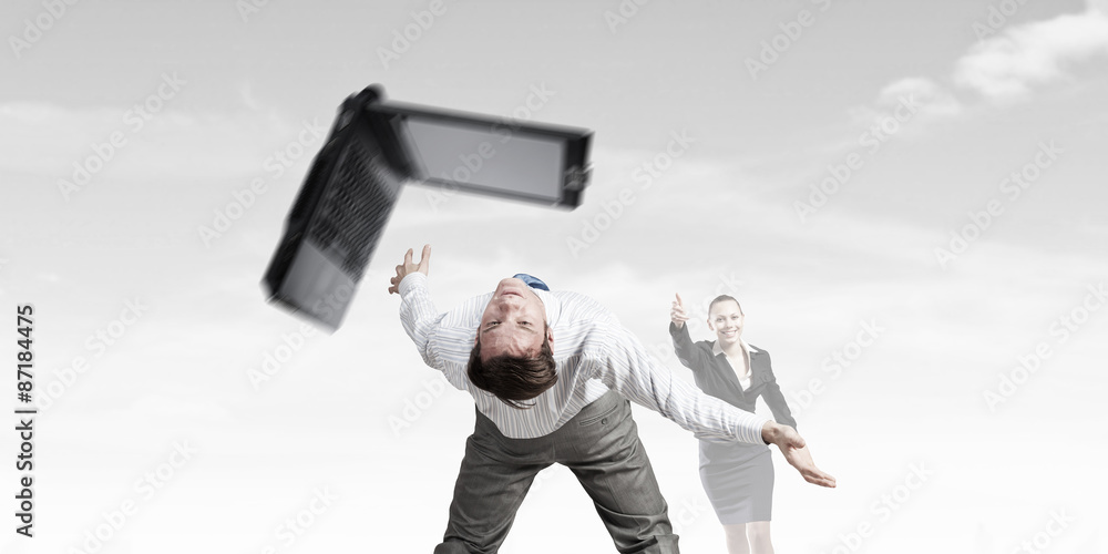 Two business people fighting with each other Two business people fighting with each other