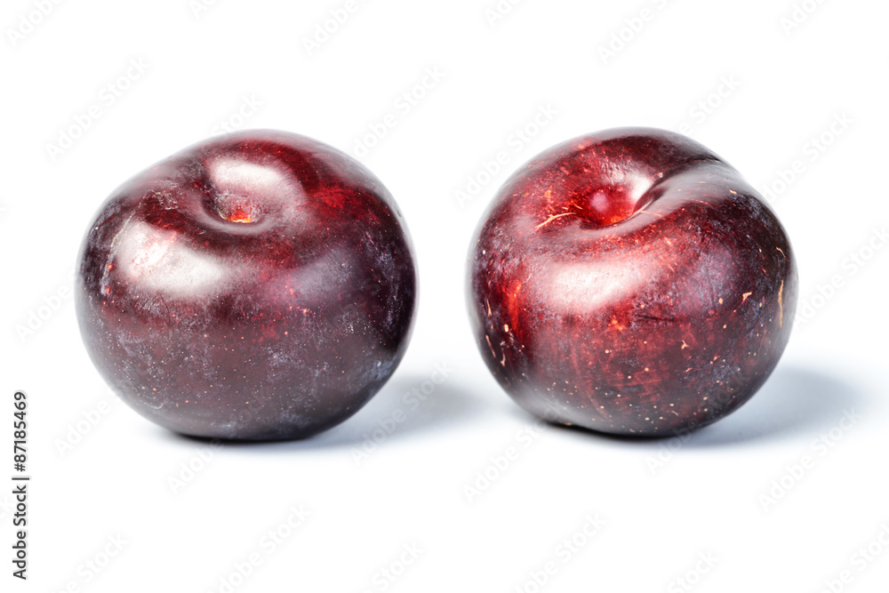 fresh plum on white, tilt shift lens