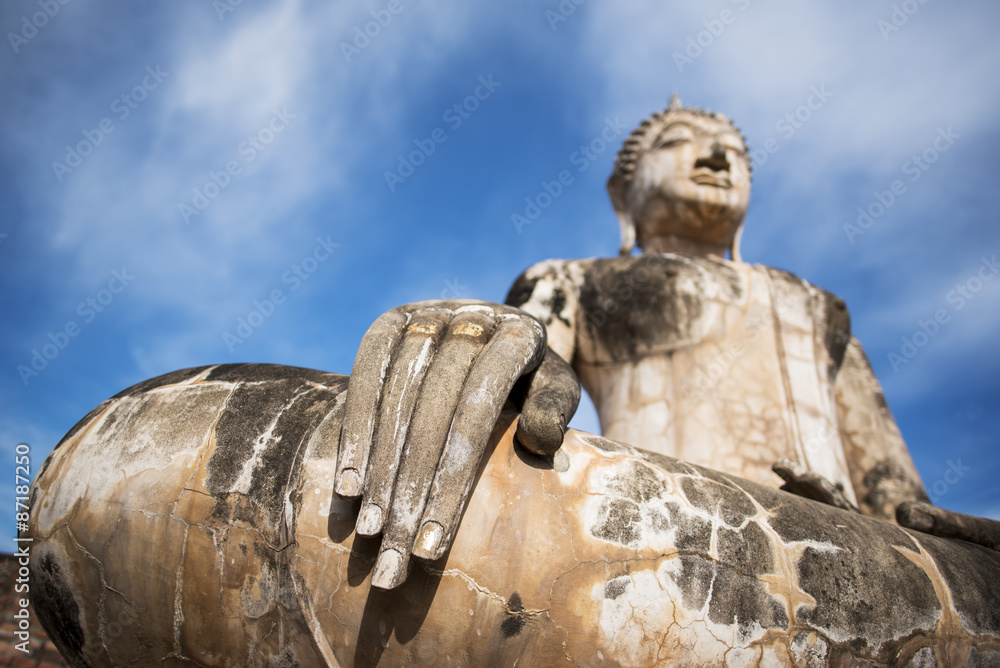 Ancient Buddha statue at Sukhothai historical park, Thailand.