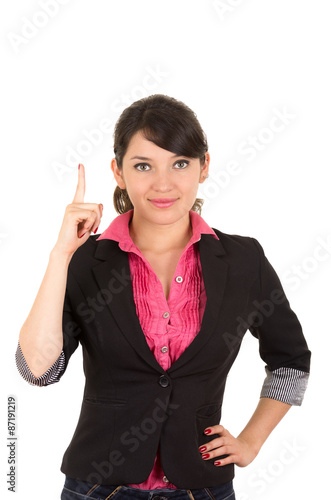 Hispanic woman in pink shirt and black blazer jacket holding one finger up for camera