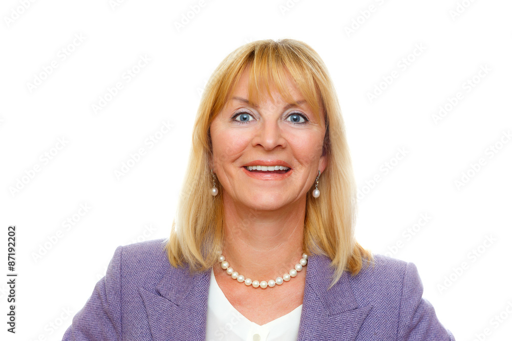 Closeup portrait of happy and smile aged senior woman 60-65 years with white teeth in suit with big blue eyes, isolated on white background, Positive human emotion, facial expression Closeup portrait of happy and smile aged senior woman 60-65 years with white teeth in suit with big blue eyes, isolated on white background, Positive human emotion, facial expression