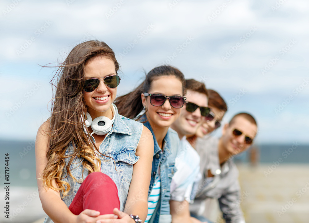 smiling teenage girl hanging out with friends