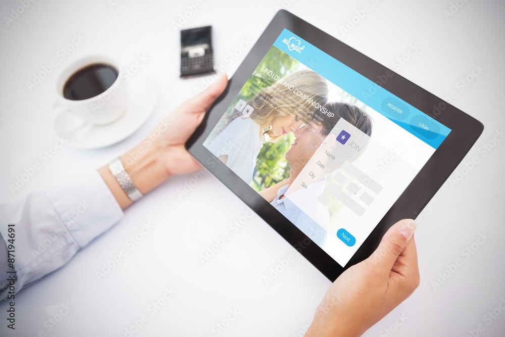 Composite image of man using tablet pc Composite image of man using tablet pc