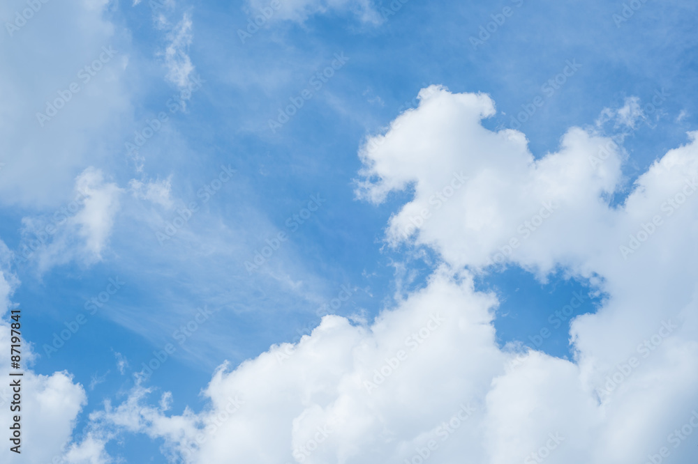 White fluffy clouds in the blue sky White fluffy clouds in the blue sky